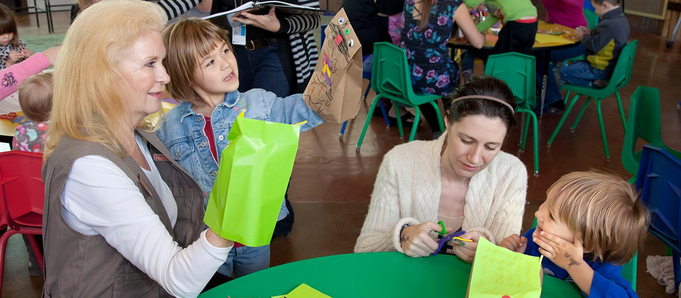 Kids playing with paper bag puppets