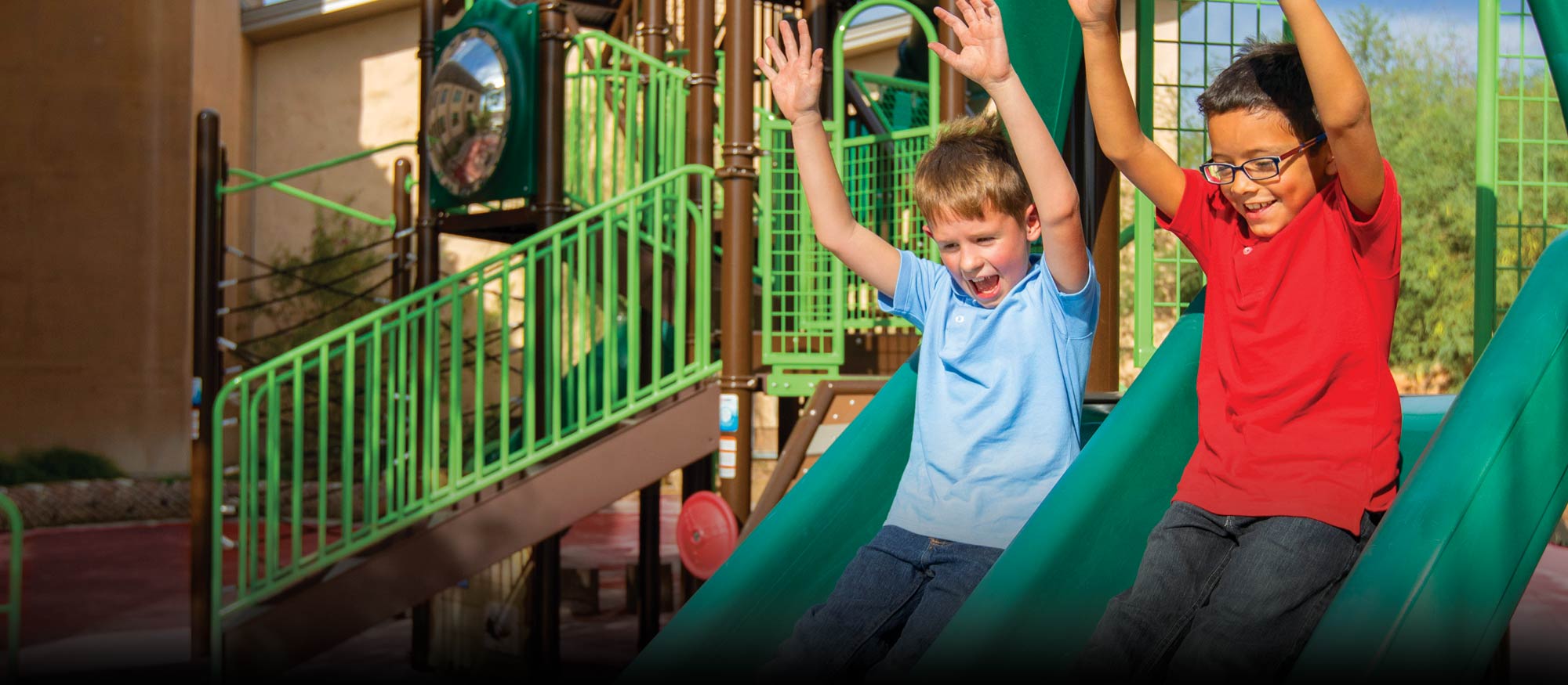 Kids playing on playground slide