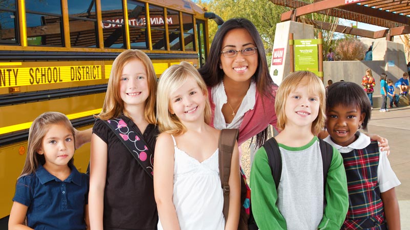 School teacher with a group of students at the Springs Preserve